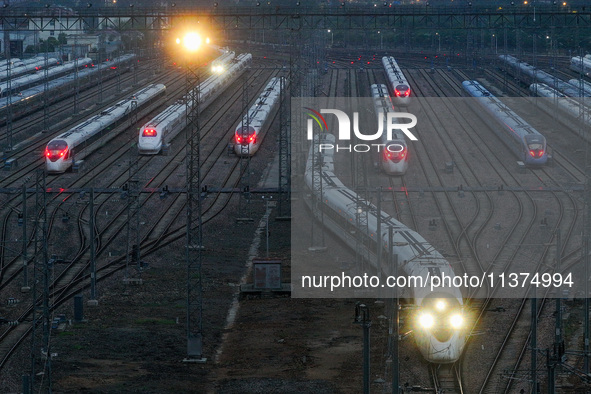 A bullet train is pulling out of the Nanjing Bullet train section in Nanjing, Jiangsu province, China, on July 1, 2024. 