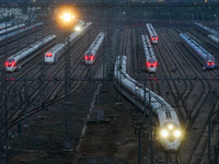 A bullet train is pulling out of the Nanjing Bullet train section in Nanjing, Jiangsu province, China, on July 1, 2024. (