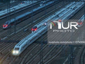 A bullet train is pulling out of the Nanjing Bullet train section in Nanjing, Jiangsu province, China, on July 1, 2024. (