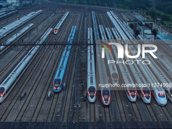 Bullet trains are stopping at the Nanjing section in Nanjing, Jiangsu province, China, in the early morning of July 1, 2024. (