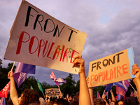 Demonstrators take part in a rally against the far right following the announcement of the results of the first round of the French parliame...