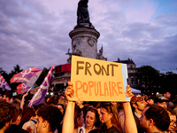 Demonstrators take part in a rally against the far right following the announcement of the results of the first round of the French parliame...