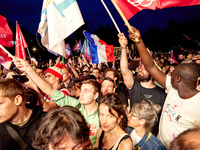 Demonstrators take part in a rally against the far right following the announcement of the results of the first round of the French parliame...