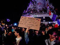 Demonstrators take part in a rally against the far right following the announcement of the results of the first round of the French parliame...