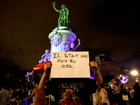 Demonstrators take part in a rally against the far right following the announcement of the results of the first round of the French parliame...