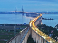 A photo taken on June 30, 2024, is showing the Shanghai-Suzhou-Nantong Yangtze River Railway Bridge in Nantong, China, on June 30, 2024. The...