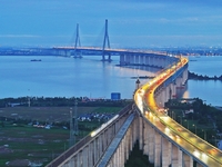 A photo taken on June 30, 2024, is showing the Shanghai-Suzhou-Nantong Yangtze River Railway Bridge in Nantong, China, on June 30, 2024. The...