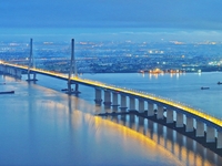 A photo taken on June 30, 2024, is showing the Shanghai-Suzhou-Nantong Yangtze River Railway Bridge in Nantong, China, on June 30, 2024. The...