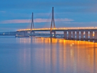 A photo taken on June 30, 2024, is showing the Shanghai-Suzhou-Nantong Yangtze River Railway Bridge in Nantong, China, on June 30, 2024. The...