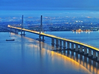 A photo taken on June 30, 2024, is showing the Shanghai-Suzhou-Nantong Yangtze River Railway Bridge in Nantong, China, on June 30, 2024. The...