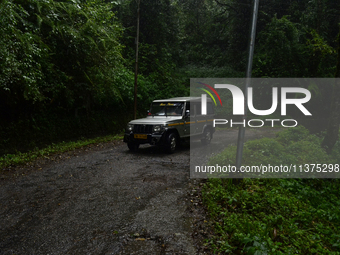 A passenger car is passing through the forest area of Singalila National Park in Darjeeling District, West Bengal, India, on June 29, 2024....