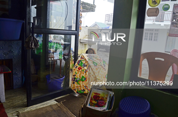 A Nepali boy is standing in front of a restaurant in Dhotrey, a village inside Singalila National Park, Darjeeling District, West Bengal, In...