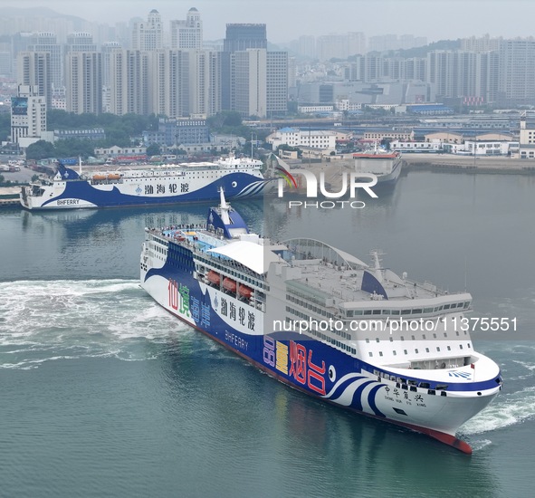 A passenger ship is sailing from Yantai to Dalian, leaving the port of Yantai in Shandong province, China, on July 1, 2024. 