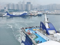 A passenger ship is sailing from Yantai to Dalian, leaving the port of Yantai in Shandong province, China, on July 1, 2024. (