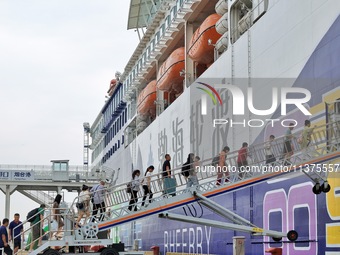 Passengers are taking a boat to Dalian at Yantai Port in Yantai, China, on July 1, 2024. (