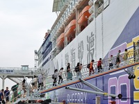 Passengers are taking a boat to Dalian at Yantai Port in Yantai, China, on July 1, 2024. (