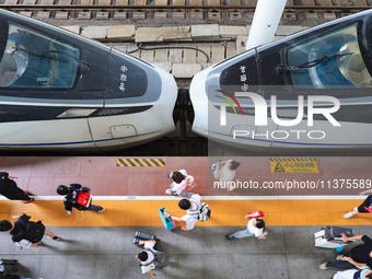 Passengers are getting off the train at Nanjing Railway Station in Nanjing, China, on July 1, 2024. (