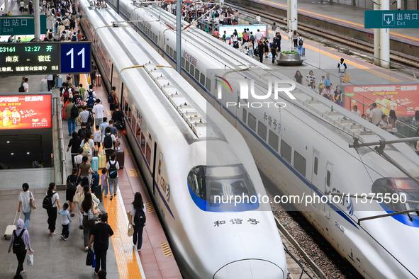 Passengers are traveling at Nanjing Railway Station in Nanjing, China, on July 1, 2024. 