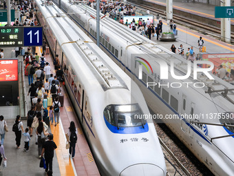 Passengers are traveling at Nanjing Railway Station in Nanjing, China, on July 1, 2024. (