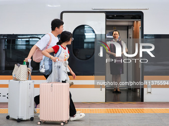 Passengers are traveling at Nanjing Railway Station in Nanjing, China, on July 1, 2024. (