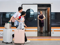 Passengers are traveling at Nanjing Railway Station in Nanjing, China, on July 1, 2024. (