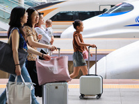 Passengers are traveling at Nanjing Railway Station in Nanjing, China, on July 1, 2024. (