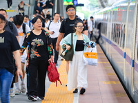 Passengers are traveling at Nanjing Railway Station in Nanjing, China, on July 1, 2024. (