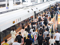 Passengers are traveling at Nanjing Railway Station in Nanjing, China, on July 1, 2024. (