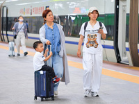 Passengers are traveling at Nanjing Railway Station in Nanjing, China, on July 1, 2024. (