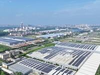 Power technicians are inspecting the operation of rooftop solar photovoltaic modules in Chuzhou, China, on June 30, 2024. (