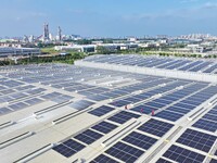 Power technicians are inspecting the operation of rooftop solar photovoltaic modules in Chuzhou, China, on June 30, 2024. (