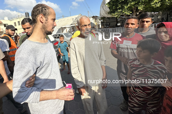 Palestinian men who are being detained by Israeli forces are arriving after their release for a check-up at the Al-Aqsa Martyrs Hospital in...