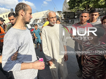 Palestinian men who are being detained by Israeli forces are arriving after their release for a check-up at the Al-Aqsa Martyrs Hospital in...