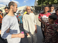 Palestinian men who are being detained by Israeli forces are arriving after their release for a check-up at the Al-Aqsa Martyrs Hospital in...