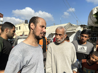 Palestinian men who are being detained by Israeli forces are arriving after their release for a check-up at the Al-Aqsa Martyrs Hospital in...