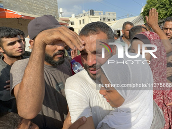 A Palestinian man who is being detained by Israeli forces is being welcomed by family and well-wishers as he is arriving after his release f...