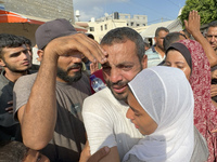 A Palestinian man who is being detained by Israeli forces is being welcomed by family and well-wishers as he is arriving after his release f...