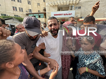 A Palestinian man who is being detained by Israeli forces is being welcomed by family and well-wishers as he is arriving after his release f...