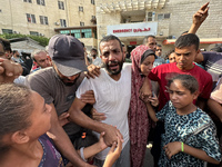 A Palestinian man who is being detained by Israeli forces is being welcomed by family and well-wishers as he is arriving after his release f...