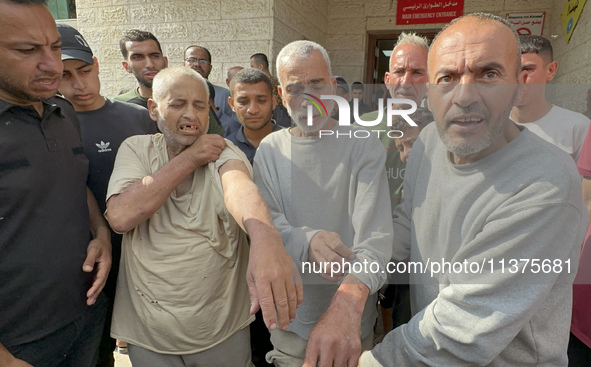 Palestinian men who are being detained by Israeli forces are arriving after their release for a check-up at the Al-Aqsa Martyrs Hospital in...