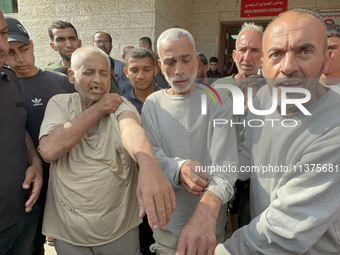 Palestinian men who are being detained by Israeli forces are arriving after their release for a check-up at the Al-Aqsa Martyrs Hospital in...