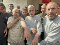 Palestinian men who are being detained by Israeli forces are arriving after their release for a check-up at the Al-Aqsa Martyrs Hospital in...