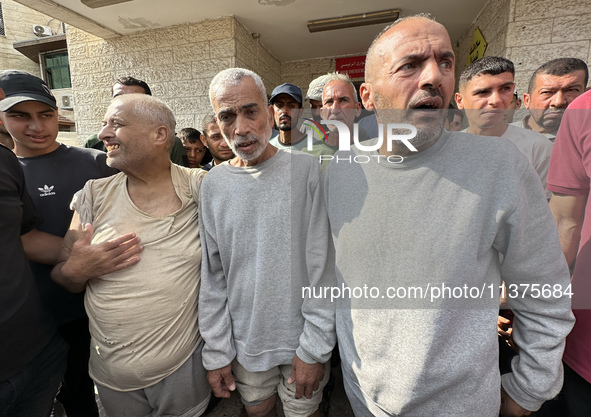 Palestinian men who are being detained by Israeli forces are arriving after their release for a check-up at the Al-Aqsa Martyrs Hospital in...