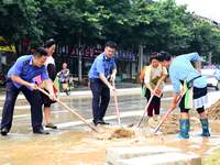 Villagers are removing silt formed by heavy rain in Congjiang county, Qiandongnan Miao and Dong autonomous prefecture, Southwest China's Gui...