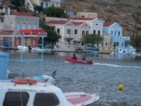 People are enjoying the warm weather this morning in Symi, Greece, on July 1, 2024. (