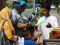 People are buying battery fans on a hot summer day in Srinagar, Jammu and Kashmir, on July 01, 2024. (