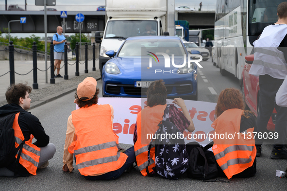 Climate activists from the Last Generation (Ostatnia Generacja) are blocking a main road to protest against the inaction of politicians towa...