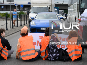 Climate activists from the Last Generation (Ostatnia Generacja) are blocking a main road to protest against the inaction of politicians towa...