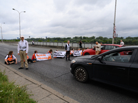 Climate activists from the Last Generation (Ostatnia Generacja) are blocking a main road to protest against the inaction of politicians towa...