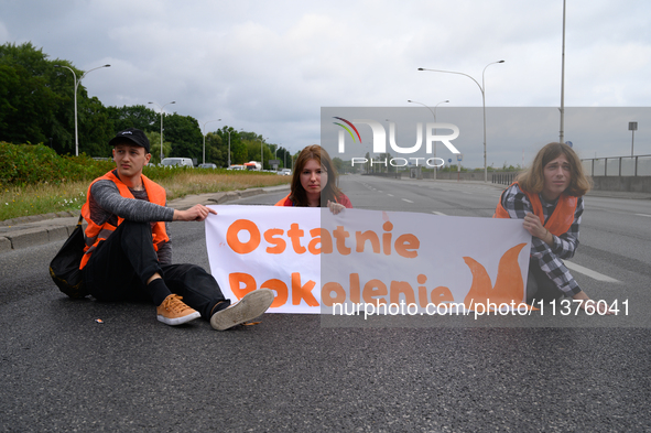 Climate activists from the Last Generation (Ostatnia Generacja) are blocking a main road to protest against the inaction of politicians towa...